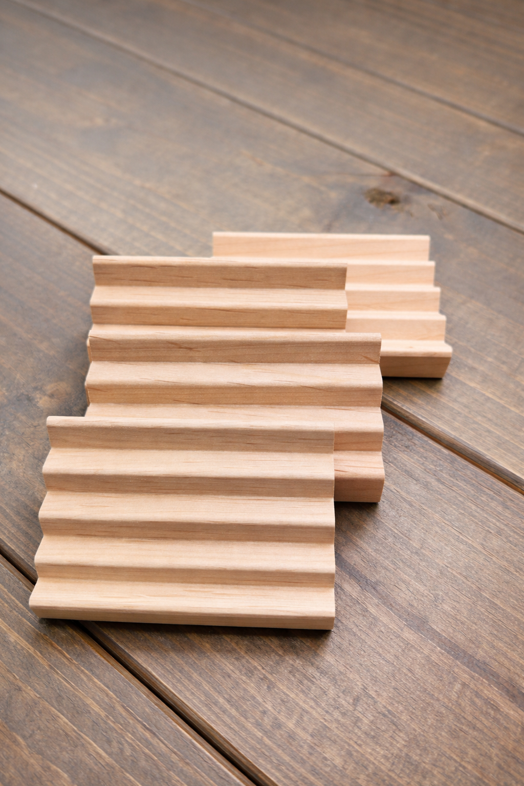 Wooden soap dish on a wooden surface