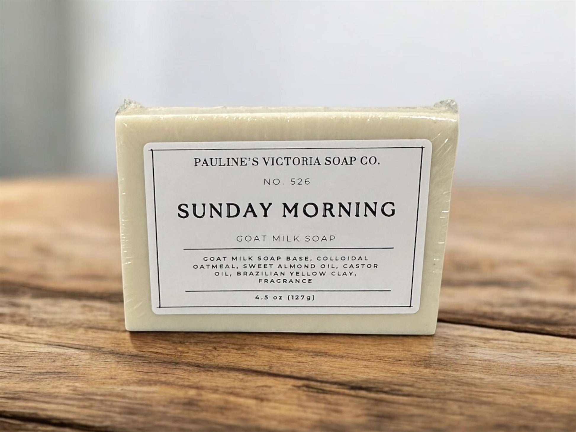 Goat milk Bar of soap with a label on a wooden surface